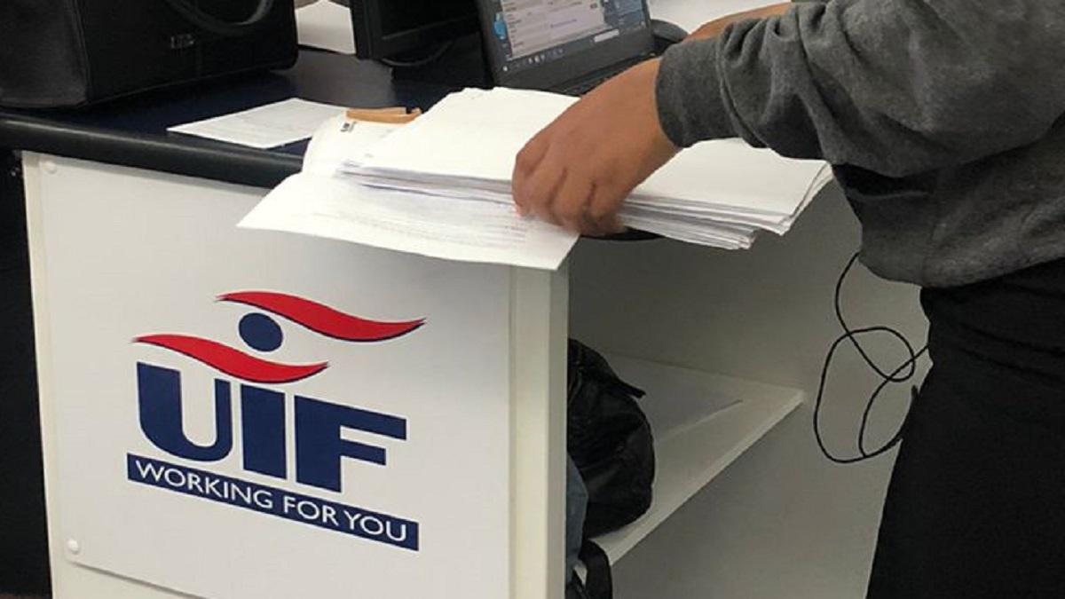 UIF client submitting application form at labour centre