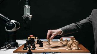 Human play chess with an AI robot