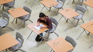 A CET student writing their ABET exams.