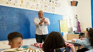 A teacher leading a class discussion.
