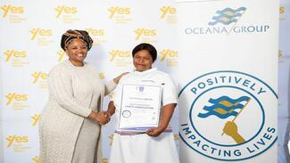 Zodwa Velleman, Oceana executive for communication and regulatory affairs, congratulates Nomthandazo Quleka on qualifying as a food handler.