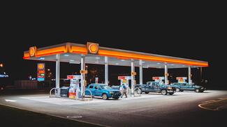 consumers fueling their cars with petrol at Shell garage