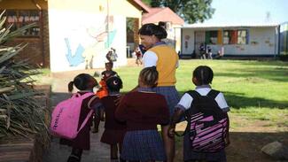 Parent takes children to school