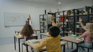 Learners with their Hands Raised