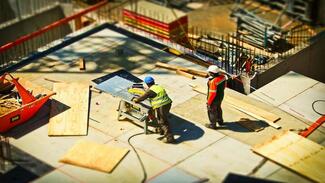Two men working on a construction site
