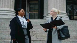 Females with documents talking on street