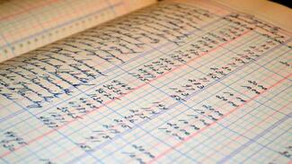 book of a person taking bookkeeping courses