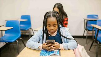 school girl on her phone