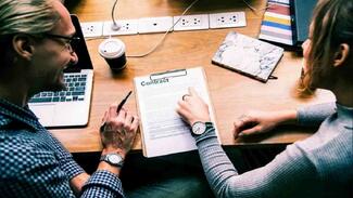 person signing employment contract