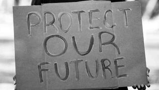 youth holding a poster