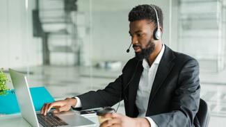 african man working at a desk