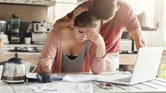 couple trying to manage their debt